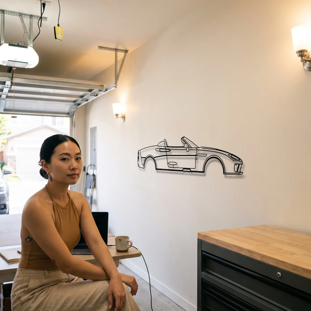 Spyker C8 Spyder metal wall art shown to scale beside a person