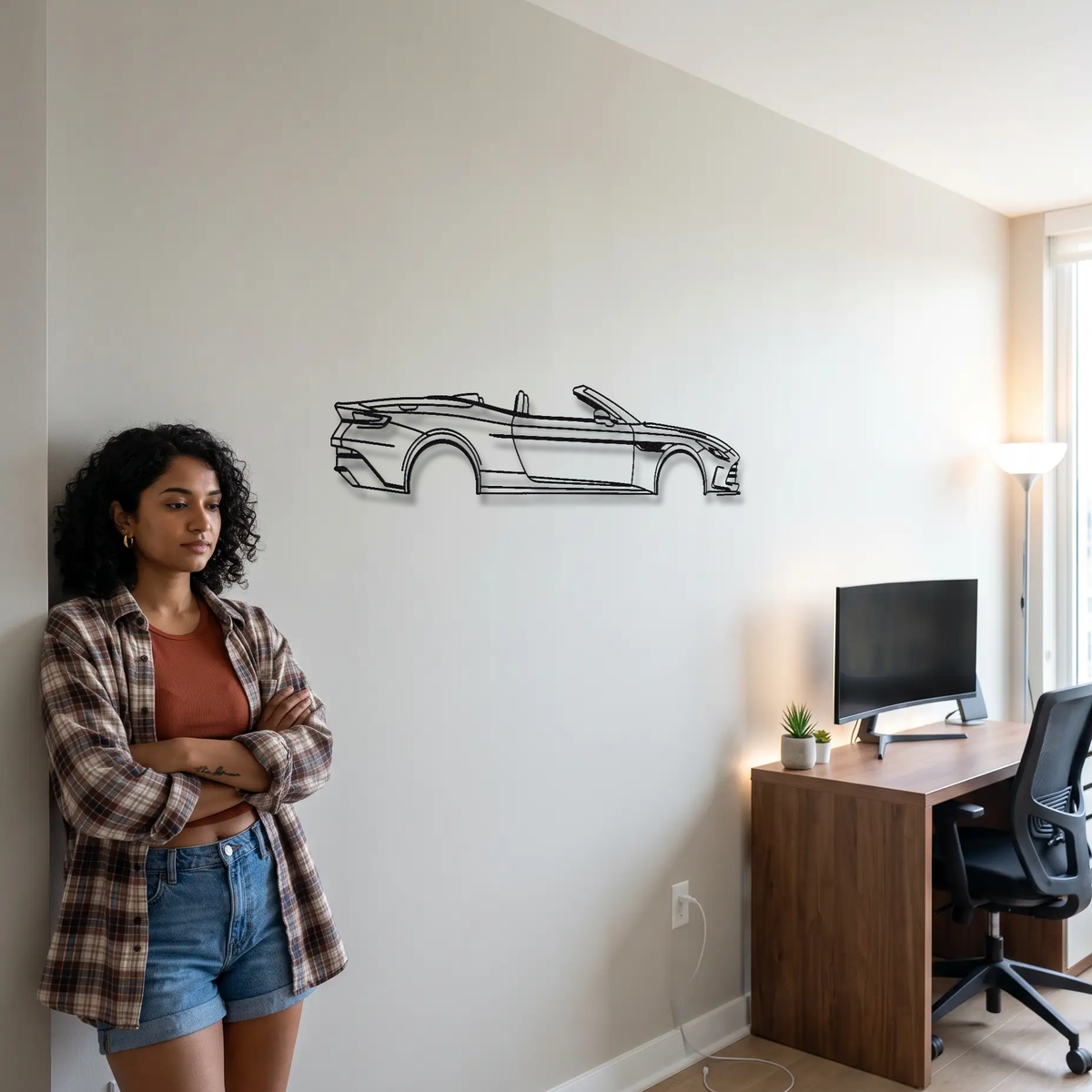 Aston Martin DB12 Volante metal wall art shown to scale beside a person