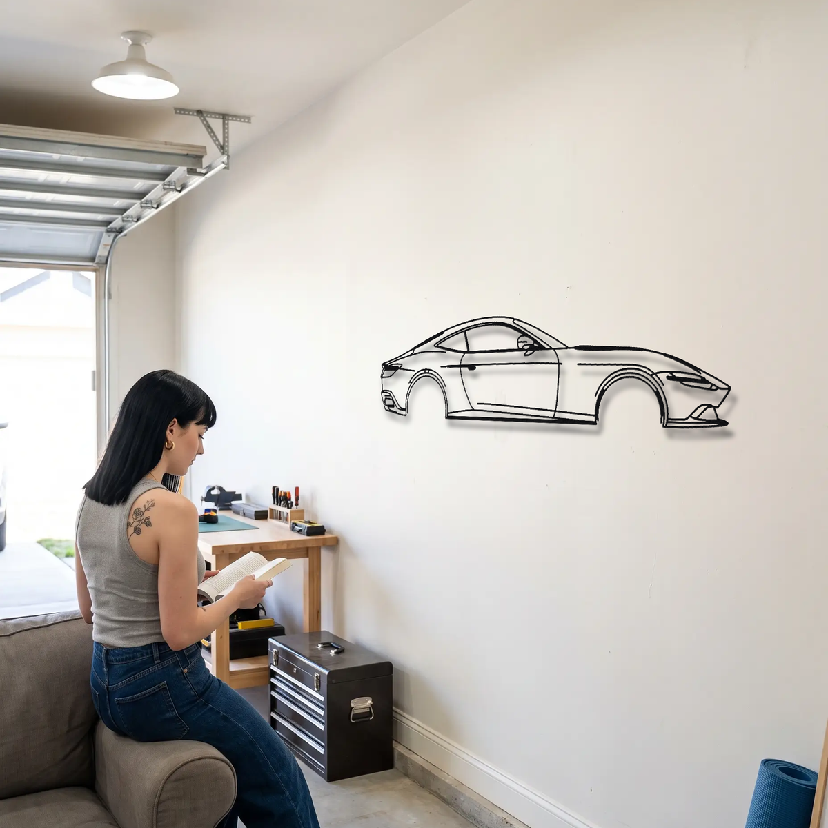Ferrari Roma metal wall art shown to scale beside a person