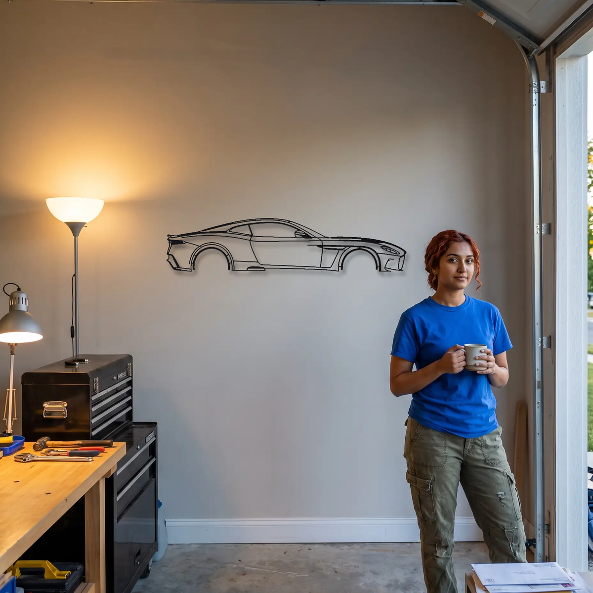 Aston Martin DBS 770 Ultimate metal wall art shown to scale beside a person