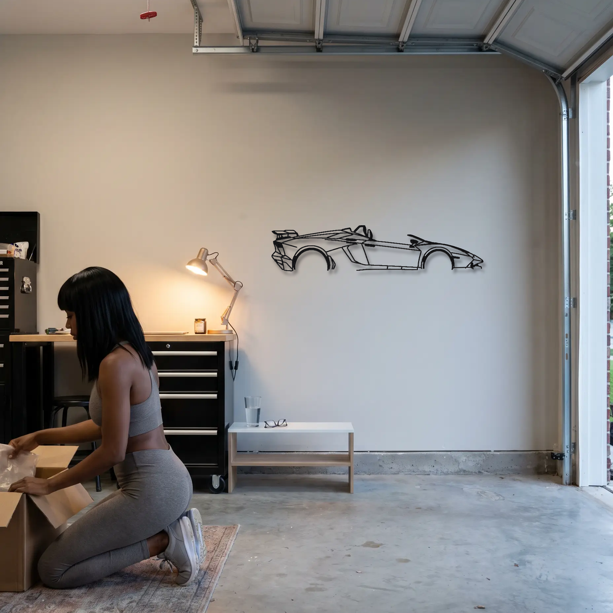 2012 Lamborghini Aventador J One-off metal wall art shown to scale beside a person