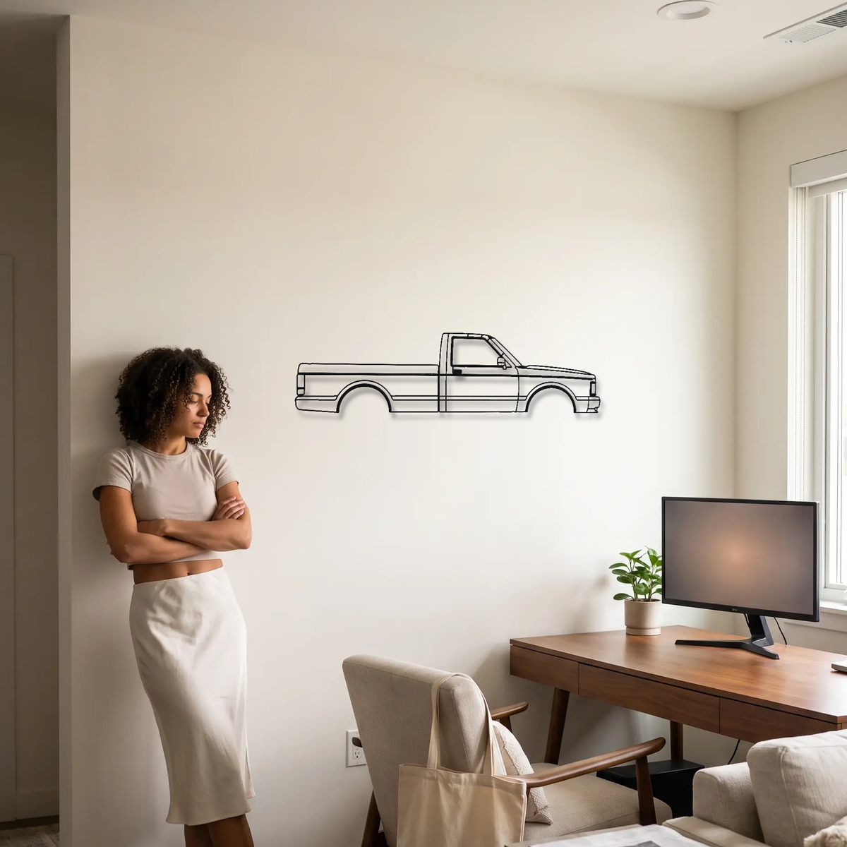 GMC Syclone metal wall art shown to scale beside a person