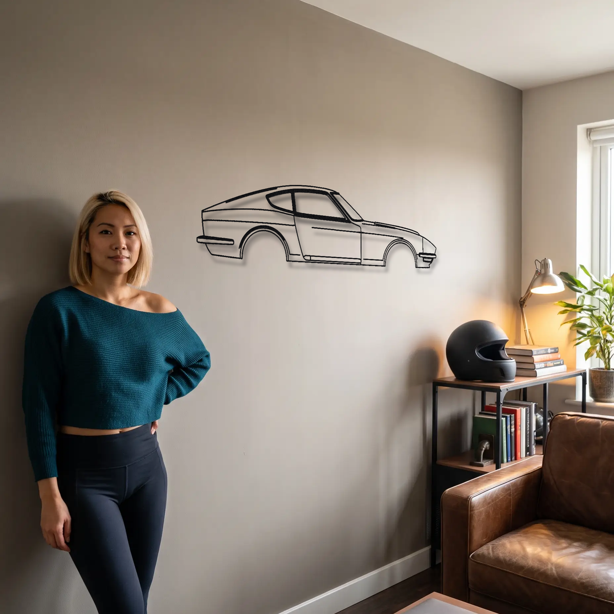 Datsun 240Z metal wall art shown to scale beside a person