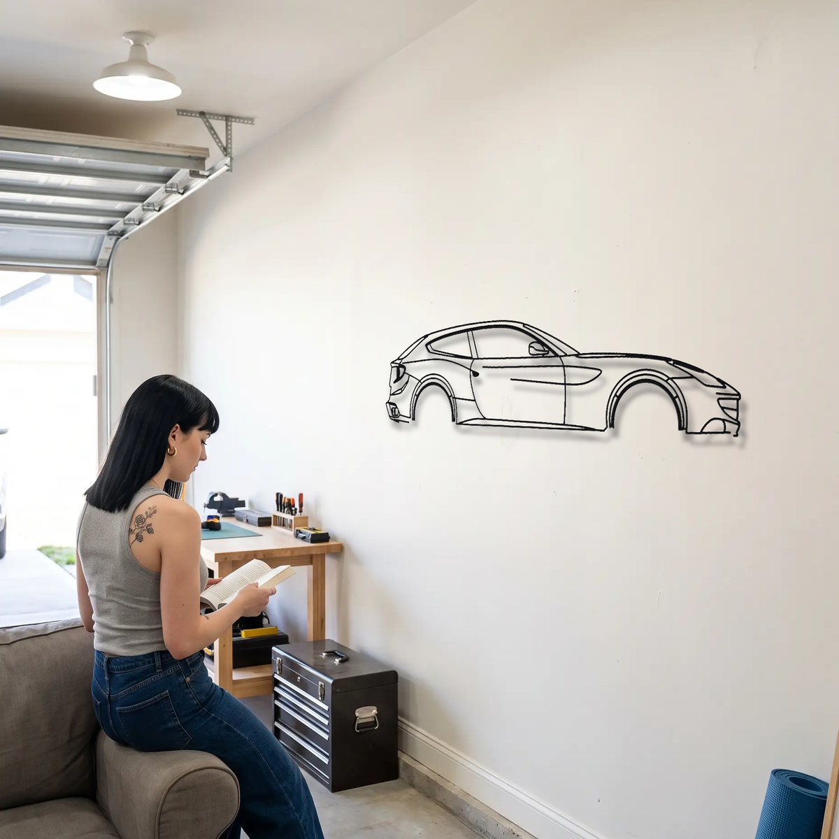 Ferrari FF metal wall art shown to scale beside a person