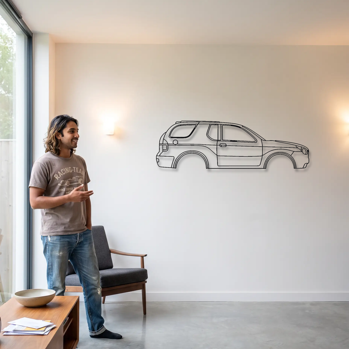 Isuzu VehiCROSS metal wall art shown to scale beside a person