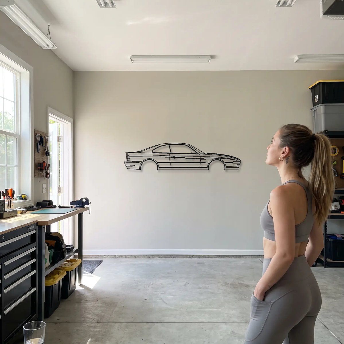 Alpina B12 5.7 Coupe E31 metal wall art shown to scale beside a person