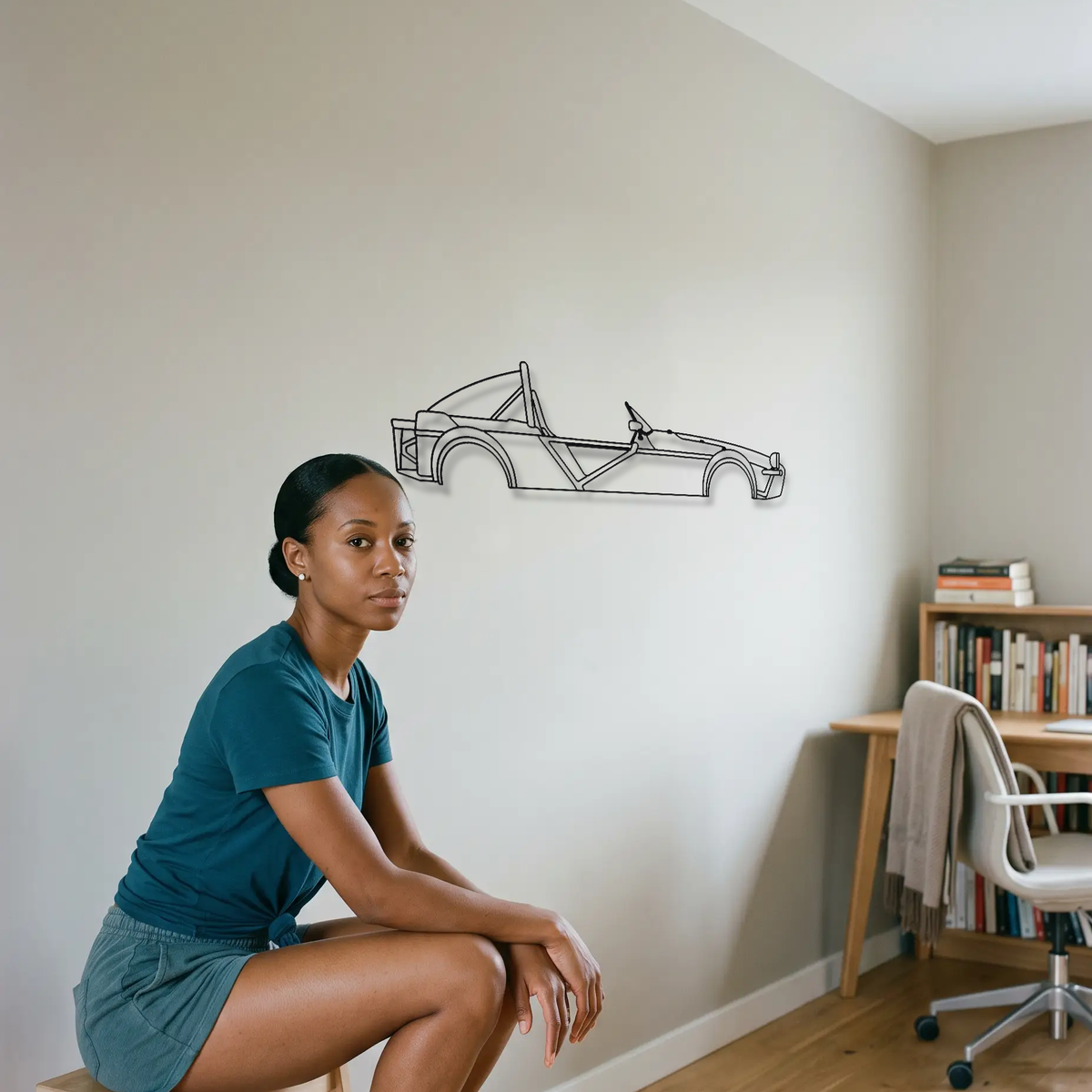 Lotus 340R metal wall art shown to scale beside a person