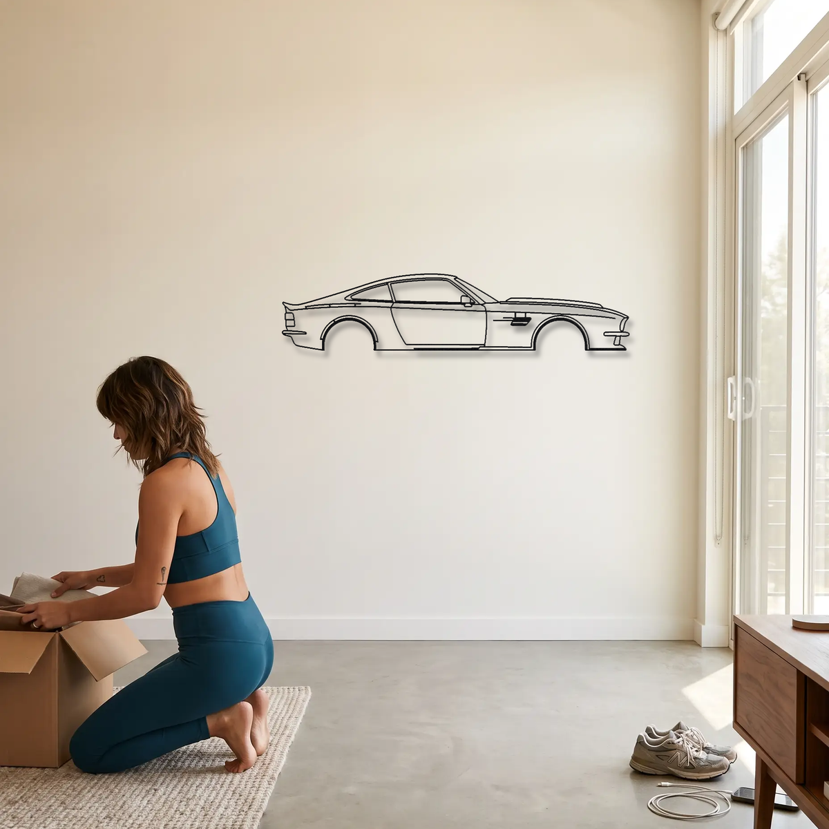 Aston Martin Victor metal wall art shown to scale beside a person
