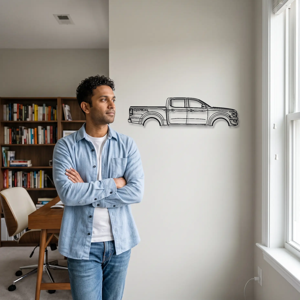 Ford Ranger Raptor metal wall art shown to scale beside a person