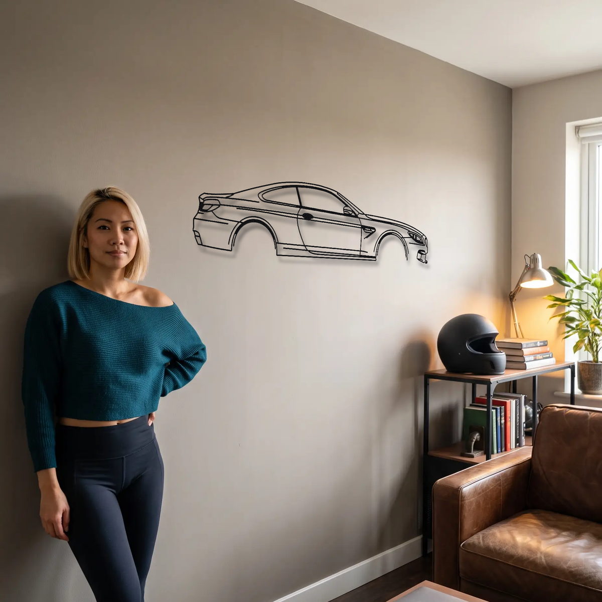 BMW M6 F13 metal wall art shown to scale beside a person