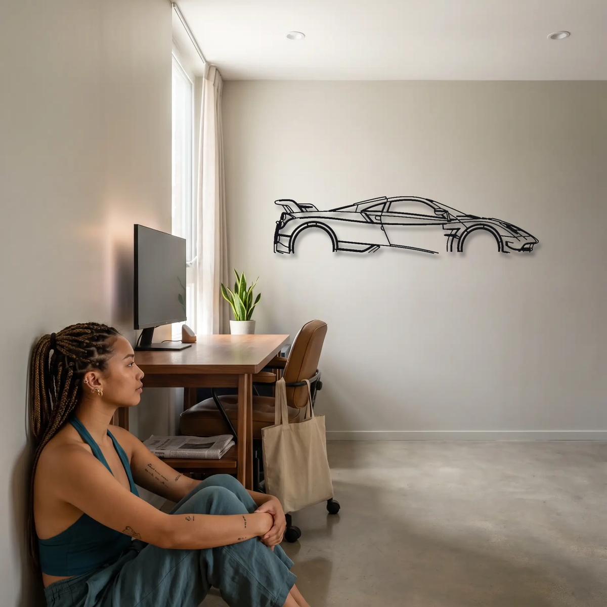 Pagani Huayra BC metal wall art shown to scale beside a person
