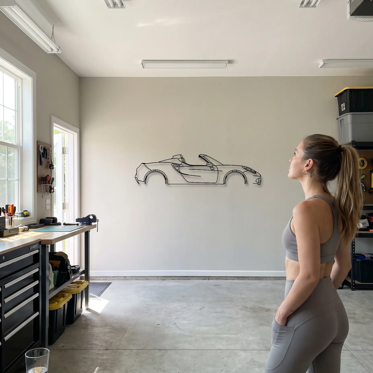Alfa Romeo 4C Spider metal wall art shown to scale beside a person