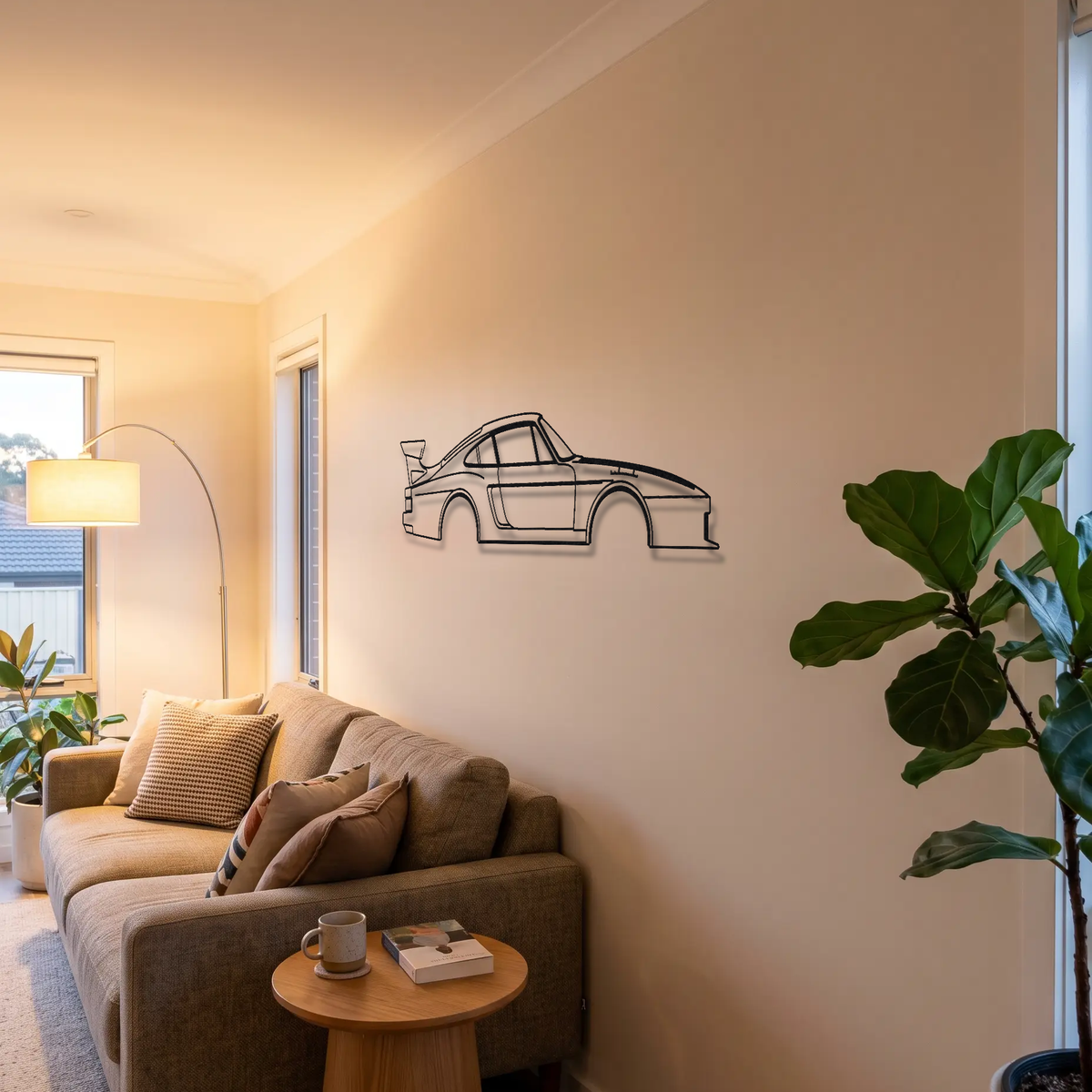 Porsche 935 metal wall art above a sofa in a living room