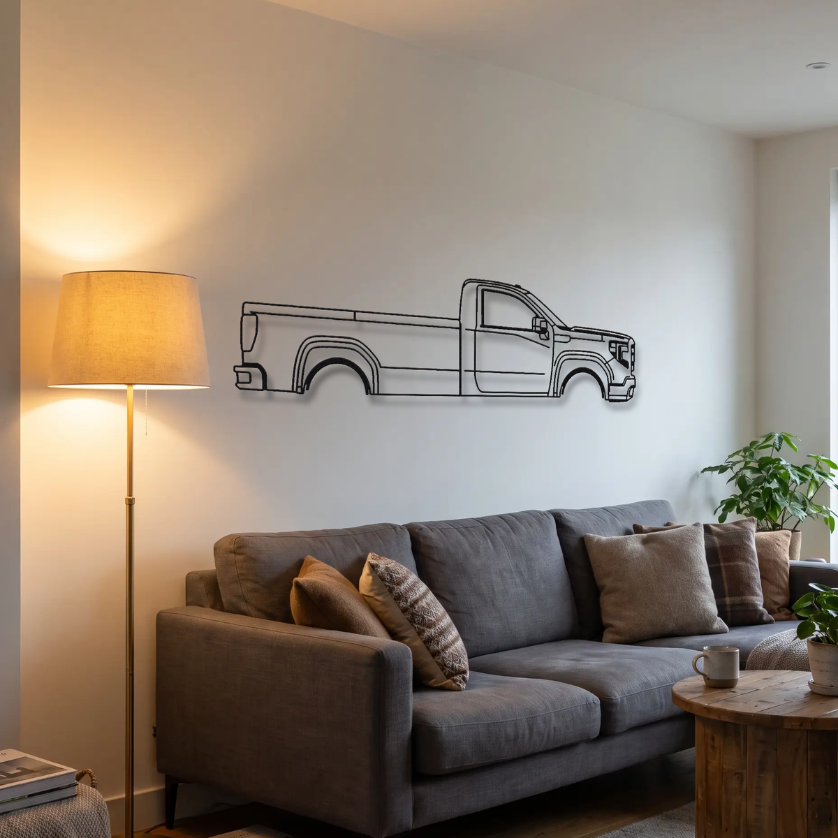 GMC Sierra T1XX metal wall art above a sofa in a living room