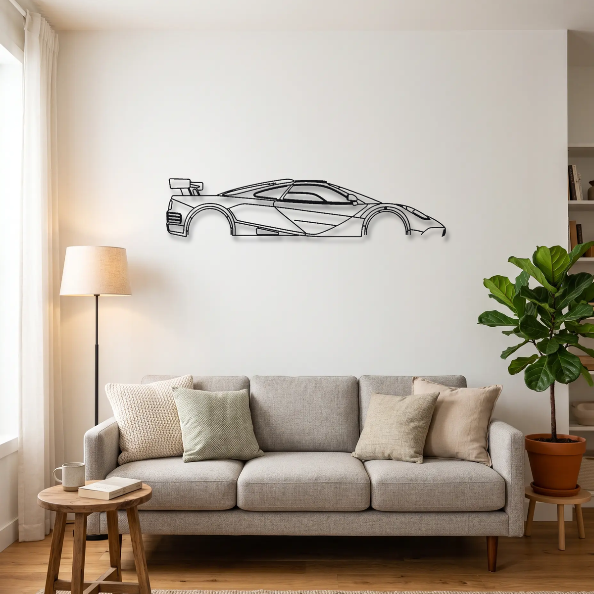 McLaren F1 LM metal wall art above a sofa in a living room