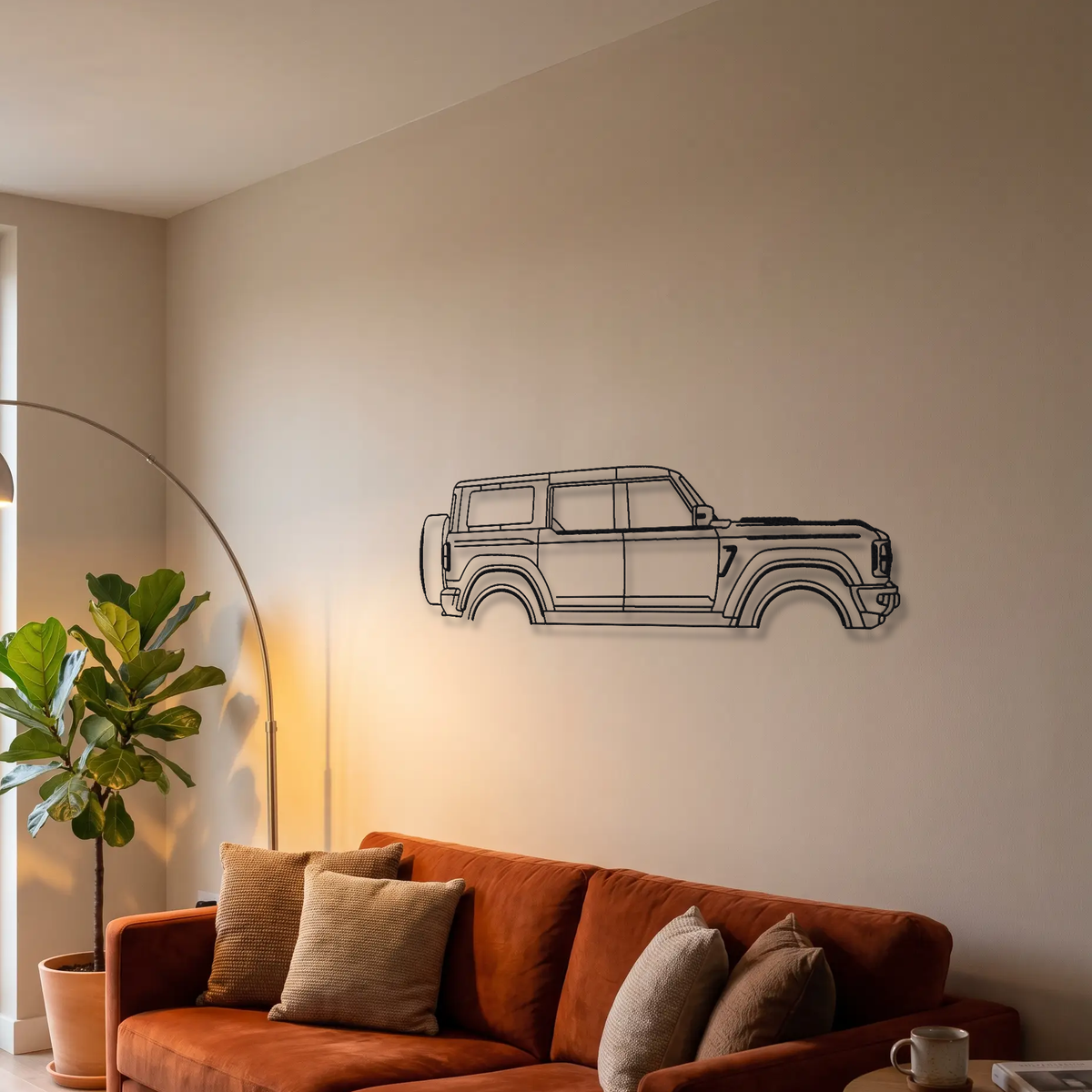 Ford Bronco Raptor metal wall art above a sofa in a living room