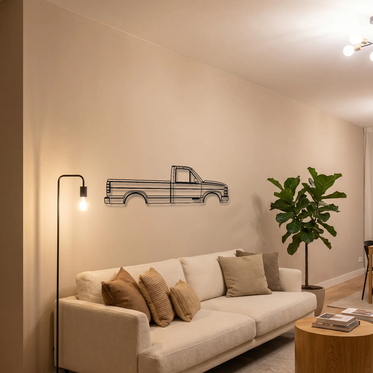 GMC Sierra K2XX metal wall art above a sofa in a living room
