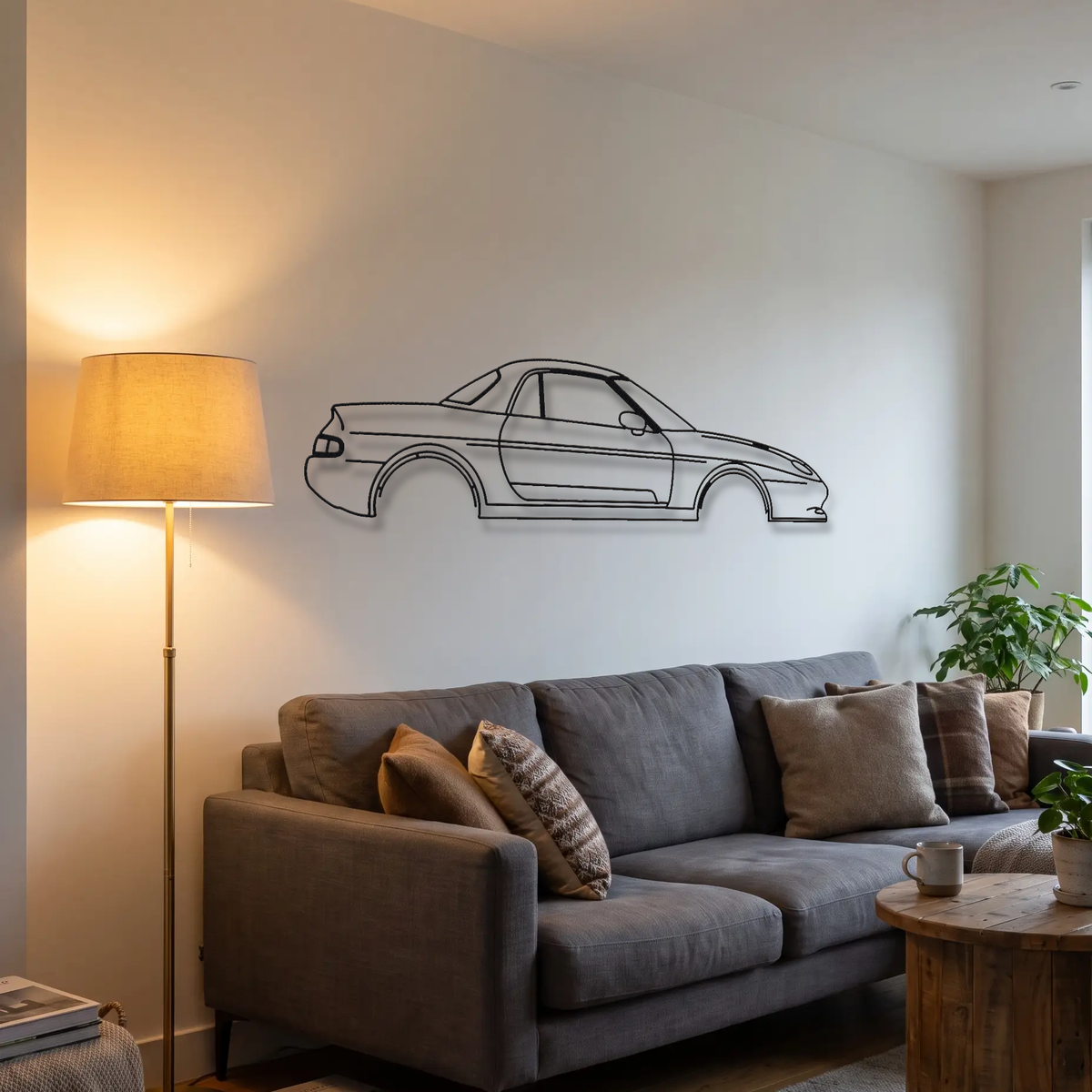 Lotus Elan M100 metal wall art above a sofa in a living room