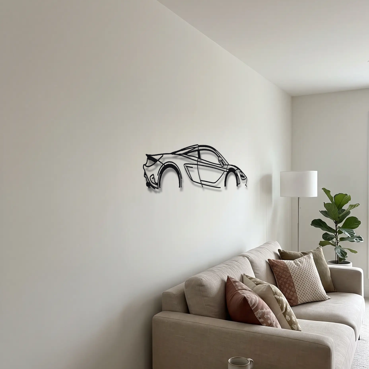 2024 McLaren 750S Le Mans metal wall art above a sofa in a living room