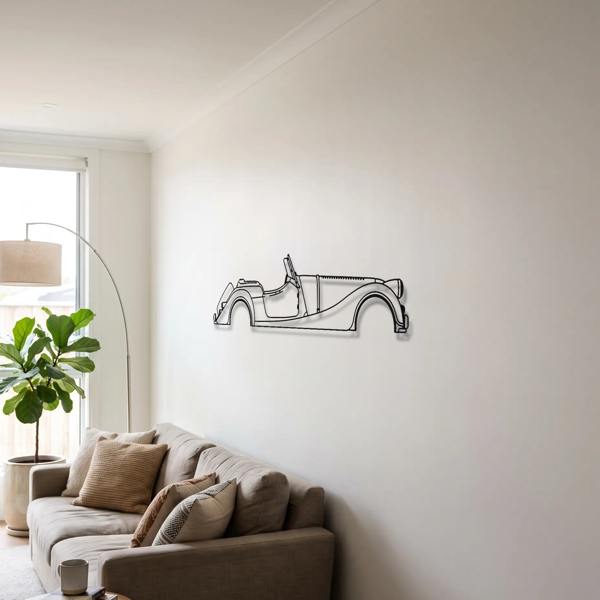 Morgan Plus Four metal wall art above a sofa in a living room