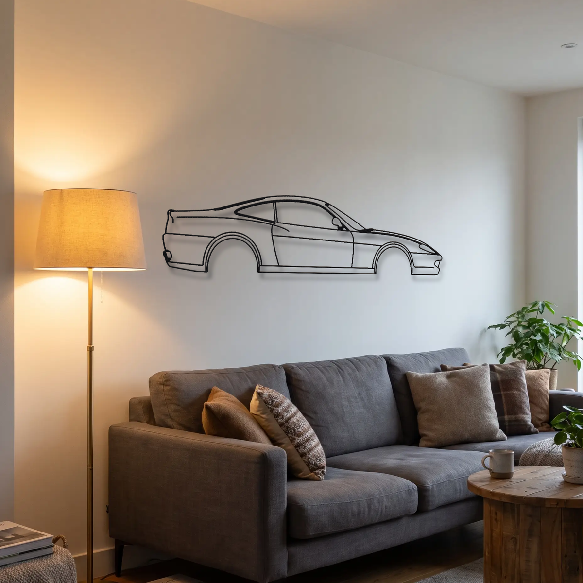 Ferrari 550 Maranello metal wall art above a sofa in a living room