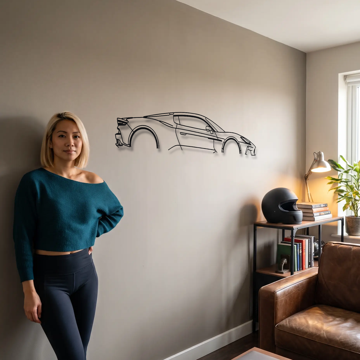 Maserati MCPura metal wall art shown to scale beside a person
