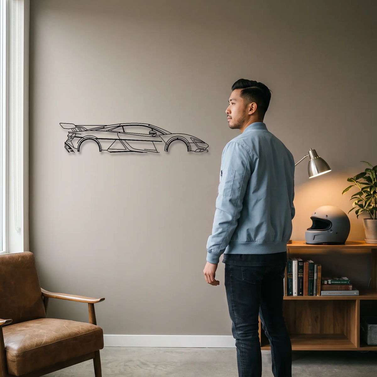 Yangwang U9 metal wall art shown to scale beside a person
