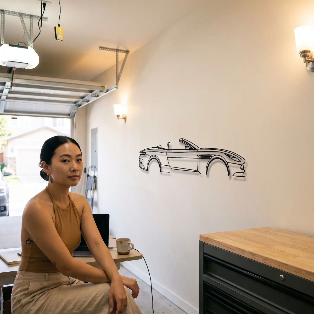 Aston Martin DB11 Volante metal wall art shown to scale beside a person