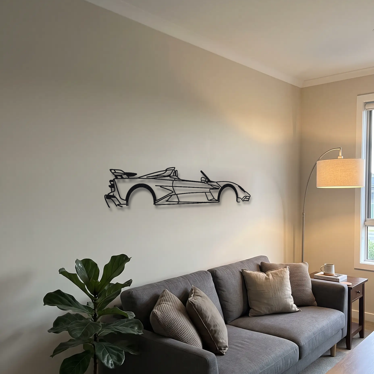 2025- Aston Martin Valhalla Spider metal wall art above a sofa in a living room