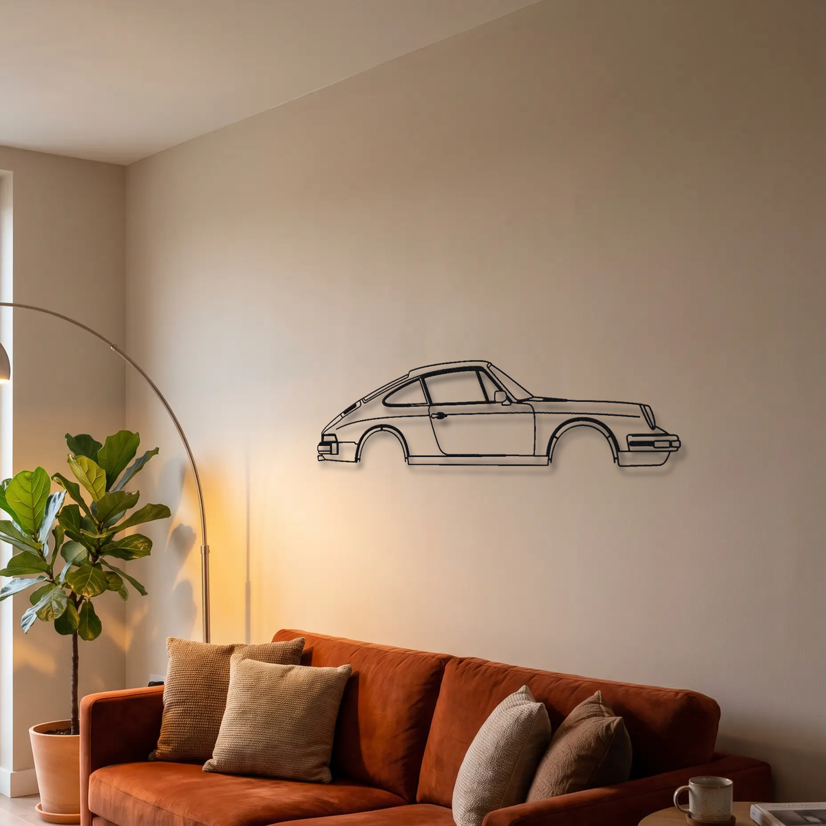 1974-1977 Porsche 911 G-series metal wall art above a sofa in a living room