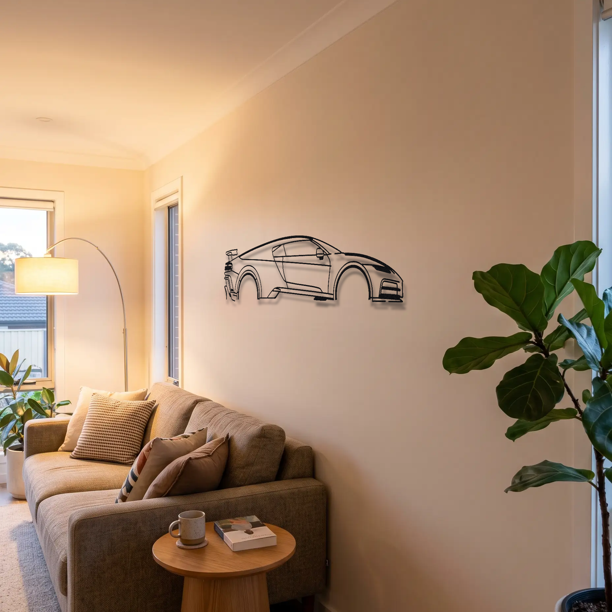 Bugatti Centodieci metal wall art above a sofa in a living room