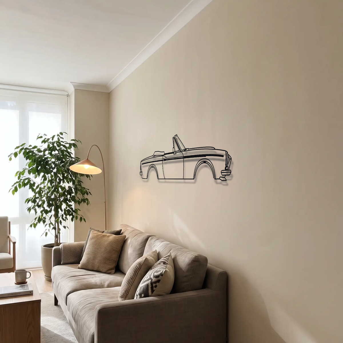 Fiat 124 Spider Abarth metal wall art above a sofa in a living room