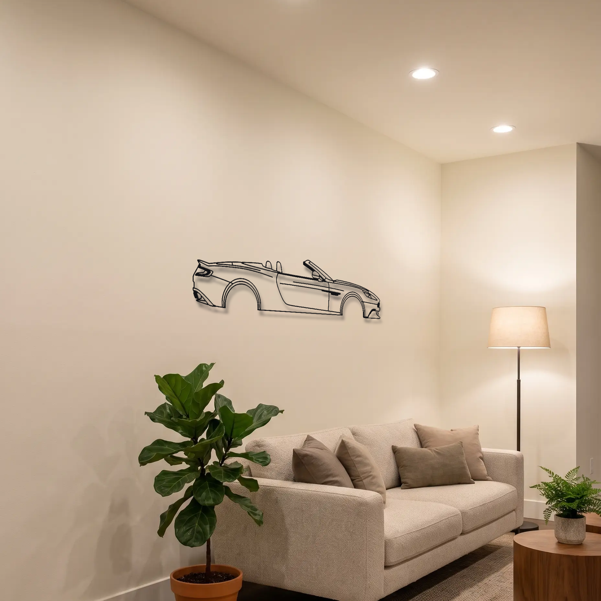 Aston Martin Vanquish Volante metal wall art above a sofa in a living room