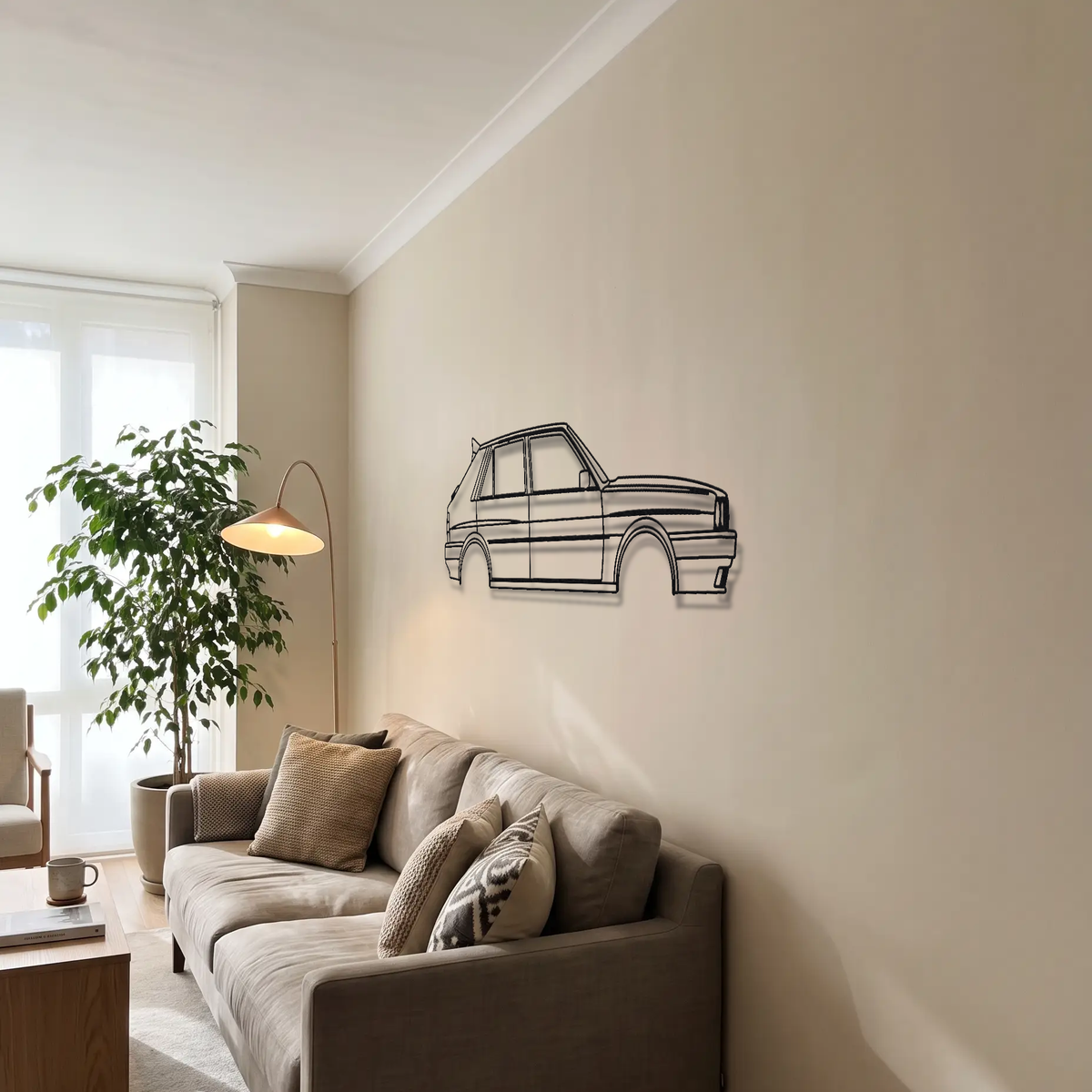 Lancia Delta HF Integrale 8V metal wall art above a sofa in a living room