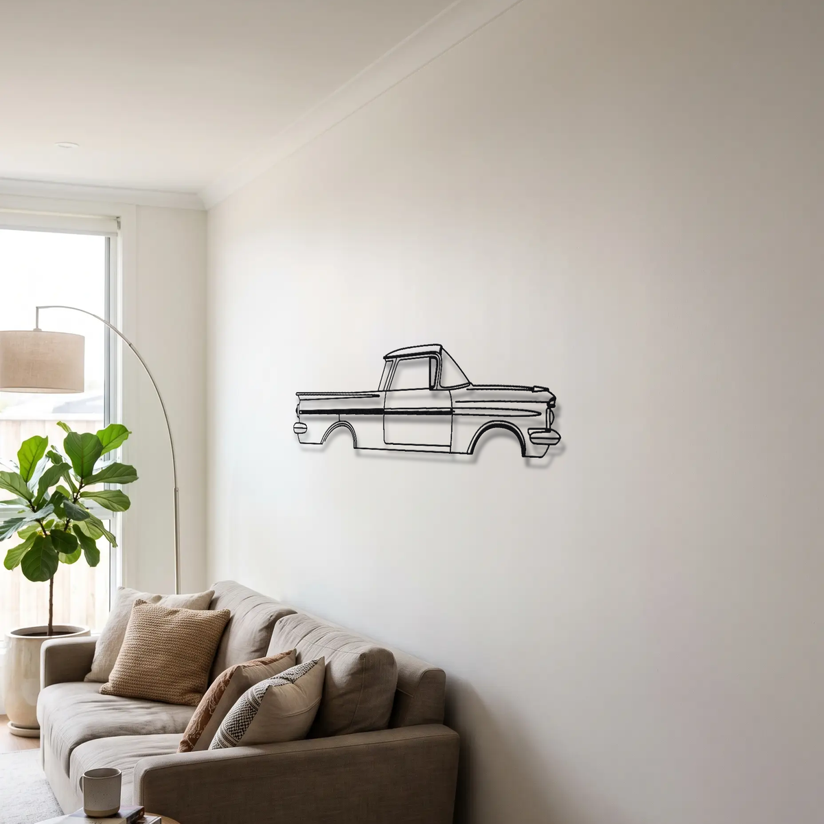 1959-1960 Chevrolet El Camino metal wall art above a sofa in a living room