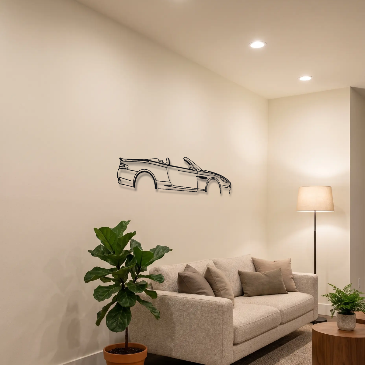2007-2012 Aston Martin DBS Volante metal wall art above a sofa in a living room