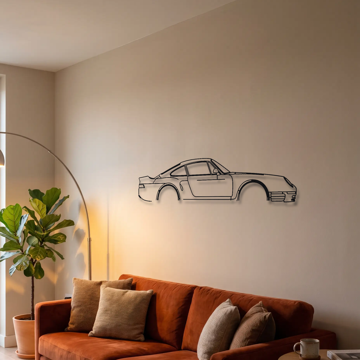 Porsche 959 metal wall art above a sofa in a living room