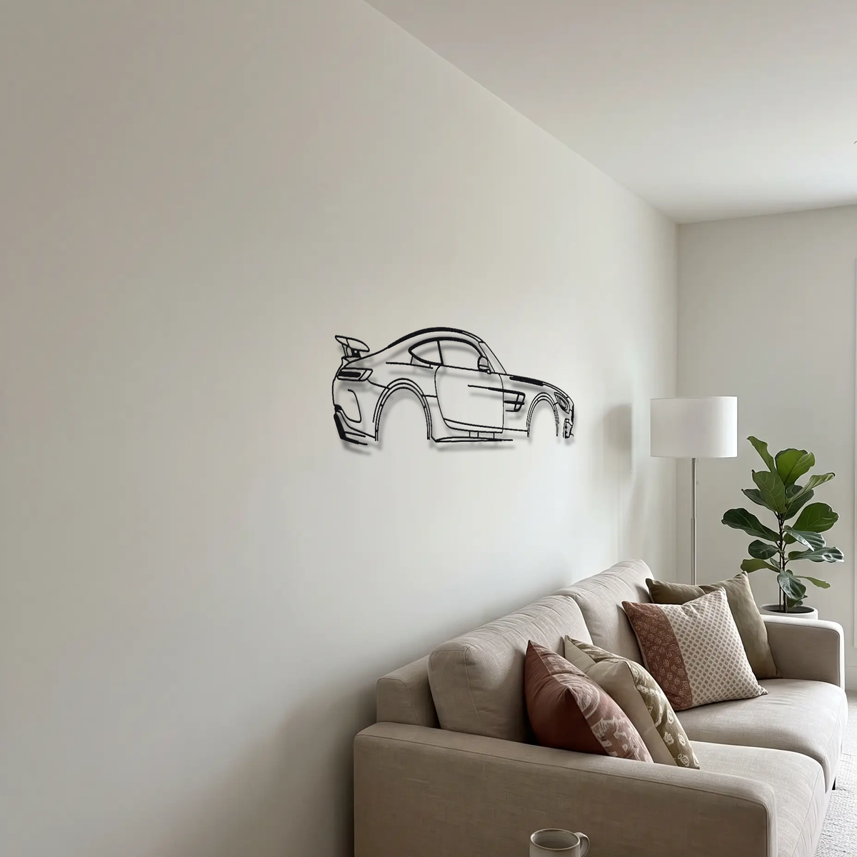 Mercedes-AMG GT R C190 metal wall art above a sofa in a living room