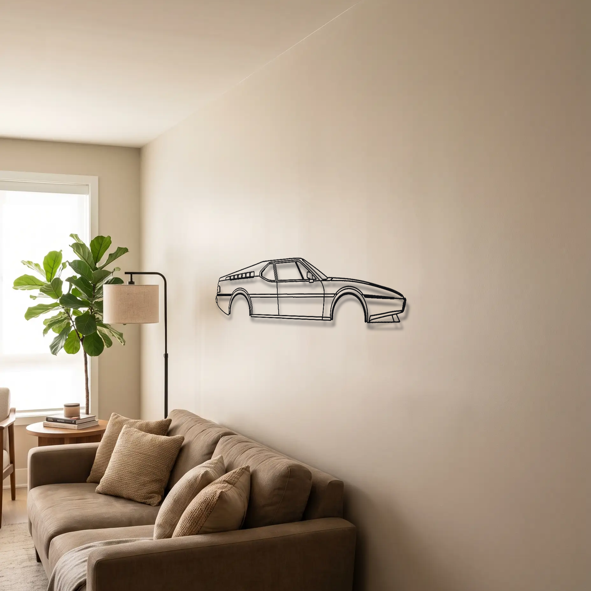 BMW M1 metal wall art above a sofa in a living room
